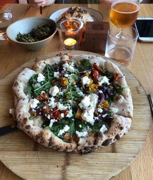 Vegetarian pizza, vegan sweet potato pasta and vegan kale chips  at The Green Spot in Barcelona