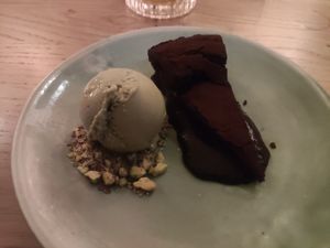 Chocolate cake with pistachio ice cream at The Green Spot in Barcelona