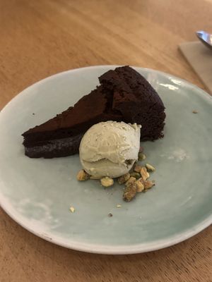 Chocolate cake with pistachio ice creamm  at The Green Spot in Barcelona
