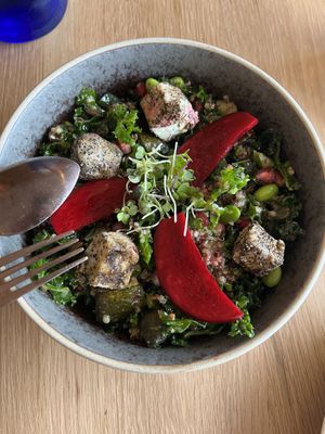 Kale and quinoa salad with roasted zucchini, edamame, watermelon radish, vegan semi-cured cheese cubes, and miso.  Highly recommended.  at The Green Spot in Barcelona