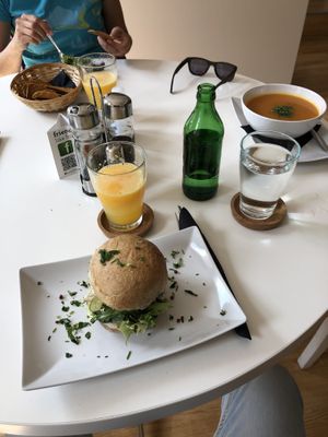 Chickpeas and tofu burger, carrots soup and peas pesto  at Rawdia in Brasov