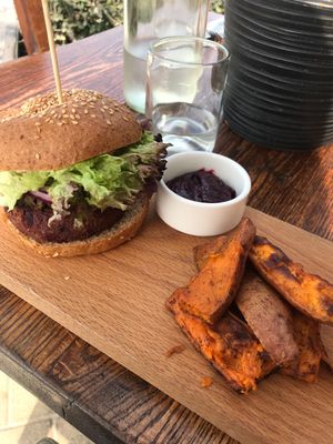 The badass burger and sweet potato wedges at Evergreen Organics in Doha
