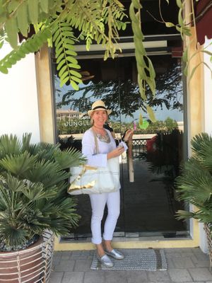 Outside entry facing the water. A little hard to find if you arrive by car. Must walk a few steps  at Evergreen Organics in Doha