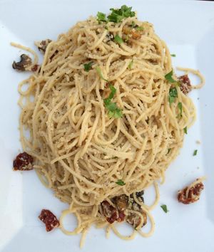Spaghetti with dressing from sunflower seeds and dried tomatoes. at Trivoli Vegan Kafeneio in Athens