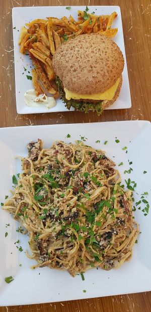 Pasta carbonara & veggie burger. at Trivoli Vegan Kafeneio in Athens