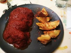 Soutzoukakia with brava potatoes at Trivoli Vegan Kafeneio in Athens