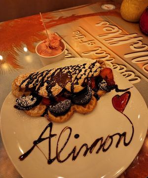 Vegan waffle with dark chocolate sauce, strawberries, Oreos. Side of vegan raspberry ice cream   at Wonder Waffel in Berlin