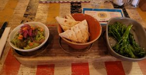 Edamame guacamole with pitta from tapas menu and tenderstem broccoli from sides #Veganuary at Lounges - Drago Lounge in Newport