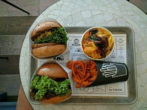 classic and guac burger with sweet potato fries and Mac and cheese at By Chloe in Los Angeles
