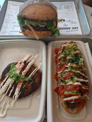 guac burger, meatball sub and hash brown at By Chloe in Los Angeles