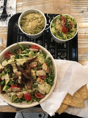 Kale Artichoke dip with chips, pesto pasta and kale Caesar salad  at By Chloe in Los Angeles