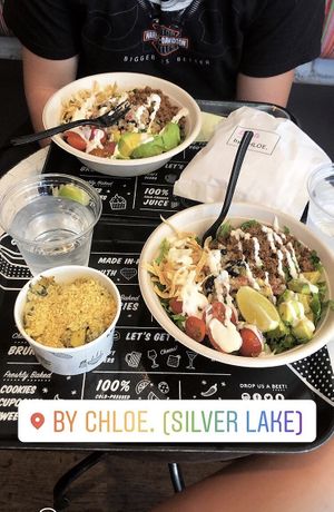 Taco salads and Mac and artichoke dip at By Chloe in Los Angeles
