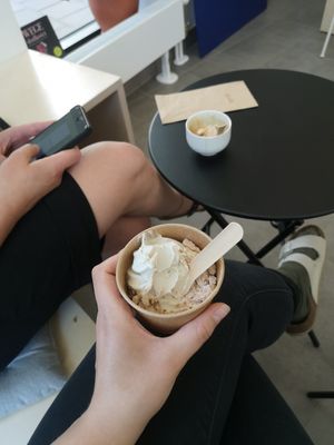 A cashew soft serve with roasted white chocolate and in the background a affogatto (an espresso shot poured on top of the ice cream) at Minù in Lund
