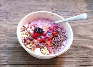 Cereals & strawberries bowl at Coco Bowls in Warsaw
