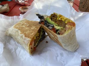 Jameys Burrito with vegan sausage  at Roots Cafe in Brooklyn