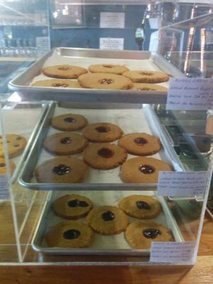 Cookie dessert case, almond apricot, almond strawberry, almond blueberry at Shangri-La Vegan - Telegraph in Oakland