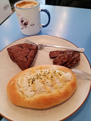 Cheese and onion bread plus chocolate scone.. at Haemil Bakery in Seoul