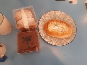 Cream bread, chocolate castella and onion bread at Haemil Bakery in Seoul