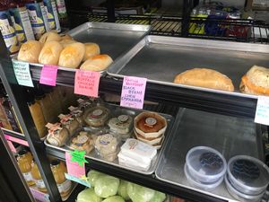 Reverie Kolache, empanada, cheese biscuit and chocolate peanut butter cups, and Goats Revolt cheeses at Farmers Market of Grapevine in Grapevine