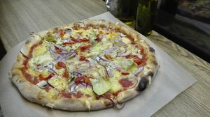 Best vegan pizza in Vilnius, you can see how much cheese they put! at Pizza di Ascari in Vilnius