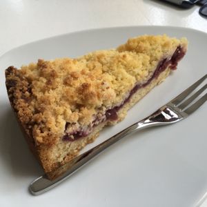 cherry crumble cake at Loving Hut Cafe in Dusseldorf