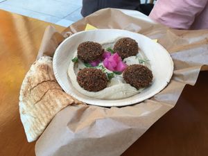Hummus with falafel and pita  at Mango Vegan Street Food - Zlota in Warsaw
