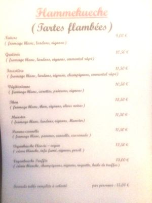 Menu. Vlammkuche with rucola, fresh mushrooms, v- white cream and truffle oil OR Vlammkuche v-classic with smoked tofu, onions, v-white cream at La Cigogne du Port in Nice