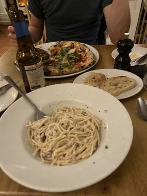 Vegan carbonara, pizza and garlic bread! Portions were large!  at Amici Ristorante in Keighley