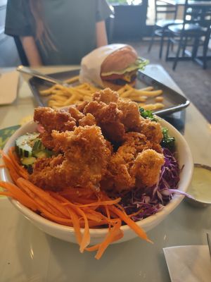 Vegan Joint Bowl with Fried Oyster Mushrooms and Black Bean Burger in the background  at TVJ Kitchen - West LA in Los Angeles