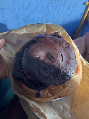 Plant based Snúður. Typical Icelandic sweet covered by a chocolate glaze. It is not labelled plan based in the bakery but if you ask to the baker, they will tell you that it is.  at Bjornsbakari in Reykjavik