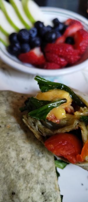Small dish cut fresh fruit with some dishes at The Green Fork & Local Roots Market in North Wales