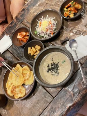 potato pancakes (VERY GOOD), ban chan, perilla seed soup with buckwheat noodles  at Dasoni in Jeju