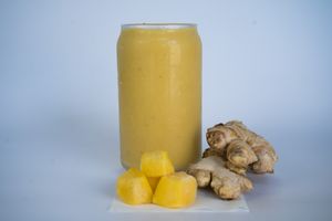 Solar Digestivo Smoothie made from apple, pineapple, papaya, mango, lemon, and ginger at Glowing Plant Based Eatery in Los Angeles