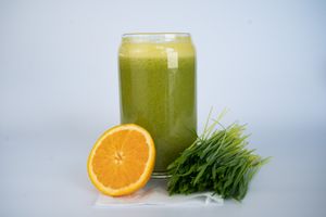 Alkalizer smoothie made from coconut meat, mango, orange, lemon, and wheatgrass at Glowing Plant Based Eatery in Los Angeles