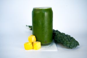 Sensual Vibes Smoothie made from coconut water, mango, spinach, kale, dates, chlorella, and apples at Glowing Plant Based Eatery in Los Angeles