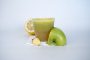 Allergy Love Tonic made from apple, lemon, ginger, cayenne pepper, apple cider vinegar, and nettle at Glowing Plant Based Eatery in Los Angeles