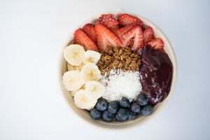 The Acai Bowl made from Acai blend (acai, blueberries, strawberries, banana, apples, and dates), banana, strawberries, blueberries, coconut shreds, and gf granola at Glowing Plant Based Eatery in Los Angeles