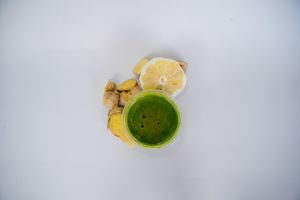 Flu shot made from Lemon, garlic, ginger, wheatgrass, cayenne pepper, and oil of oregano at Glowing Plant Based Eatery in Los Angeles