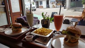 Avocado pesto burger, chili tofu burger and some side smoothies. Can't ask for more! at Huggers - 허거스 in Seoul