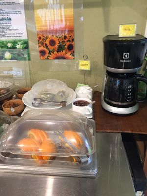 The dessert area: orange slices, bread and jam and cream and brewed coffee.  at Veg Green in Seoul