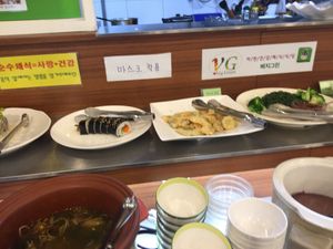 The sweet and sour dish is next to the kimbap.  at Veg Green in Seoul