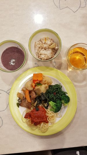 Fried mushrooms, pasta with tomato sauce and porridge at Veg Green in Seoul