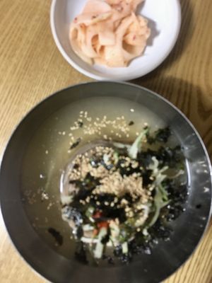 Apologies for the blurriness. This is the mul makguksu without egg with the vegan pickled radish on the side.  at DunNae MakGukSu in Busan