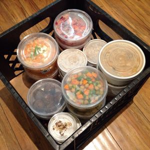 selection of cold and hot plant-based dishes.

Basket contents often include: Soups, Salads, Stews, Sides & Snacks. at Recharge Cafe in Regina