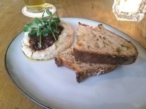 Artichoke dip with olives and sourdough at Meatless District - Da Costabuurt in Amsterdam