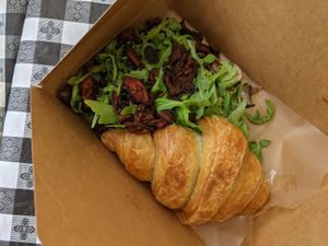 Croissant, arugula, tofu egg, seitan bacon at Sticky Fingers Diner in Washington