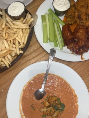 Tomato soup, half buffalo half bbq wings, fries with garlic aioli  at Sticky Fingers Diner in Washington