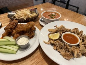 Tomato soup, fries, Mumbo wings, mushroom calamari   at Sticky Fingers Diner in Washington