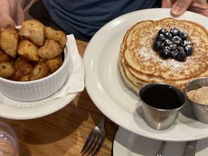Blueberry Pancakes with roasted potatoes   at Sticky Fingers Diner in Washington