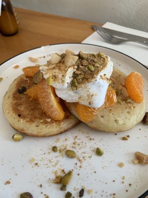 Amazing home made mandarin crumpets with coco yoghurt! at Grace in Fitzroy